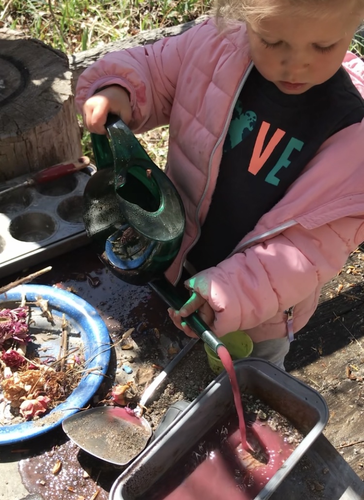 Child playing at the mud kitchen